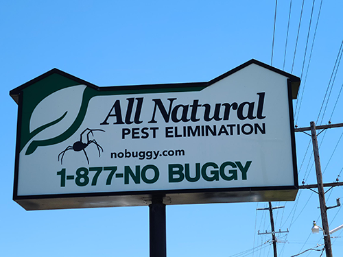 All Natural Pest Elimination Road sign